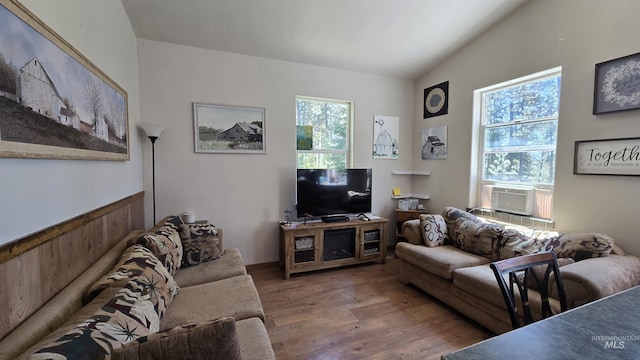 24 Shady Ln, Garden Valley, ID 83622 - living area featuring wood finished floors, cooling unit, and vaulted ceiling