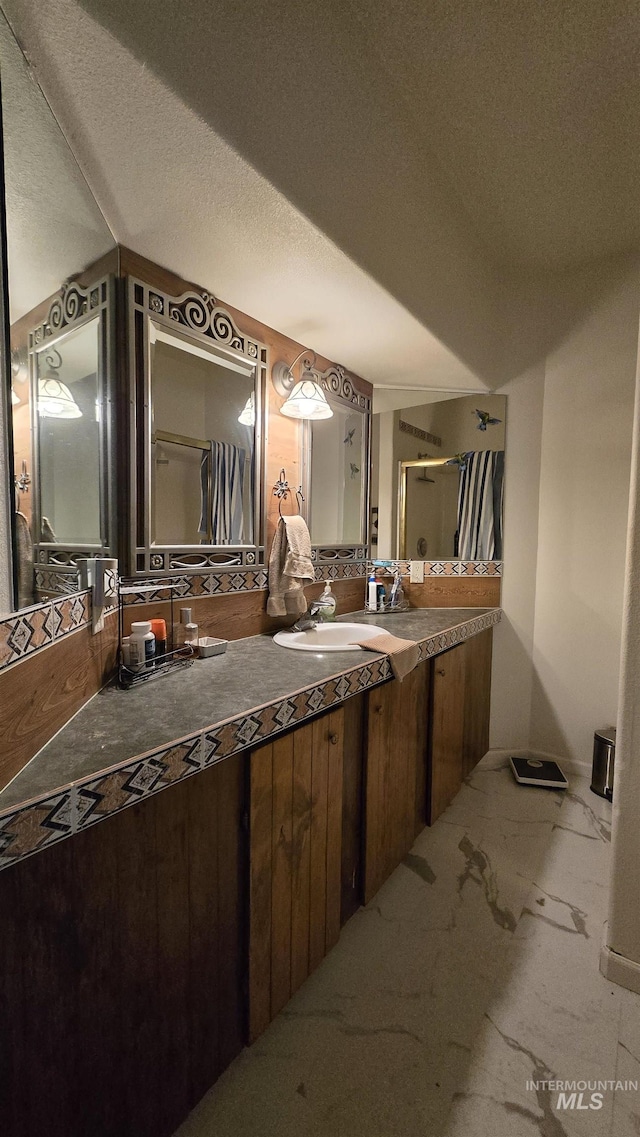 24 Shady Ln, Garden Valley, ID 83622 - full bath with a stall shower, vanity, and marble finish flooring