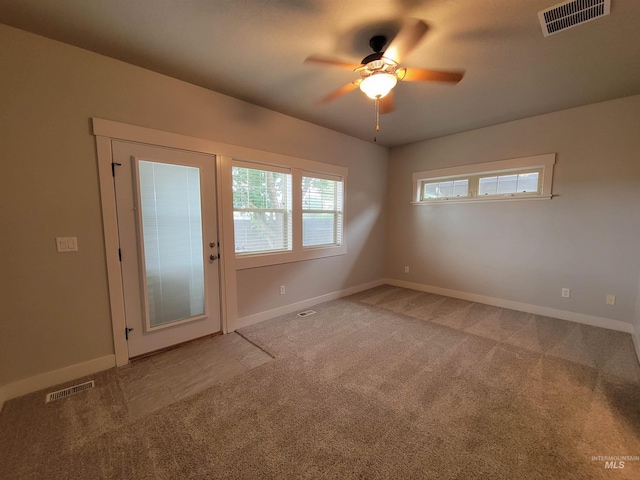 unfurnished room featuring carpet floors and ceiling fan