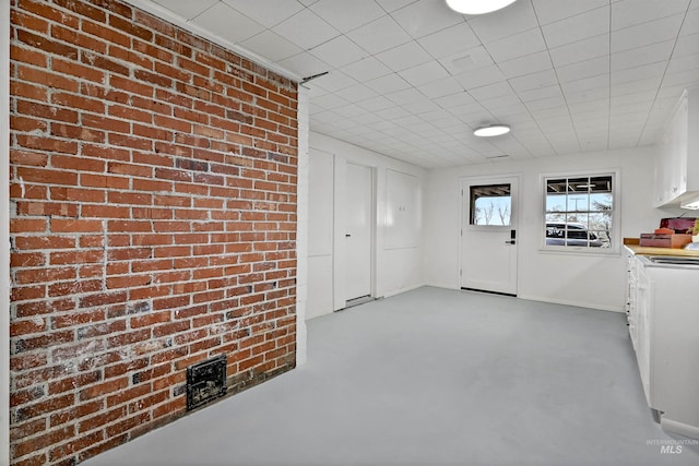 interior space with brick wall