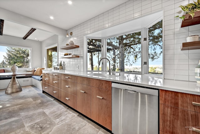 kitchen with tasteful backsplash, dishwasher, sink, and beamed ceiling