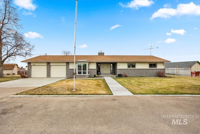 ranch-style house with concrete driveway, a front lawn, an attached garage, and brick siding