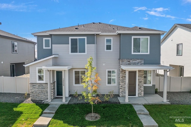 361 N Stone Canyon Ln, Star, ID 83669 - view of front of house featuring stone siding and a patio