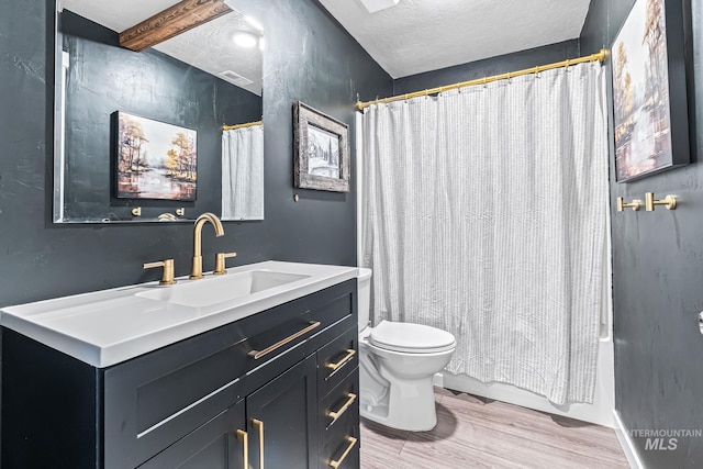 10255 W Gladiola St, Star, ID 83669 - full bathroom with vanity, wood finished floors, a textured ceiling, and shower / bath combo