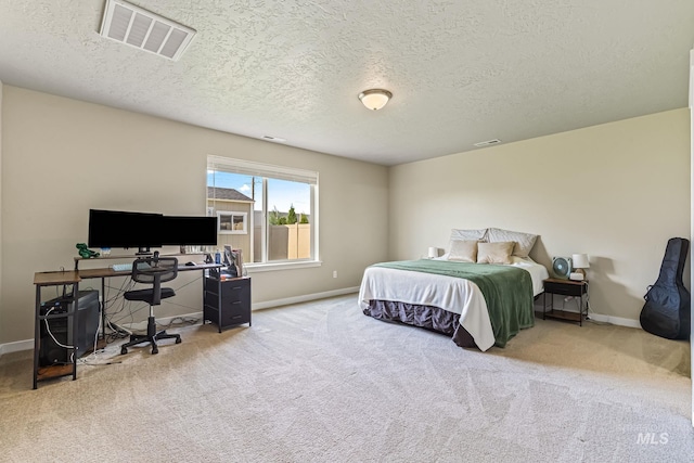 10255 W Gladiola St, Star, ID 83669 - carpeted bedroom with a desk and a textured ceiling