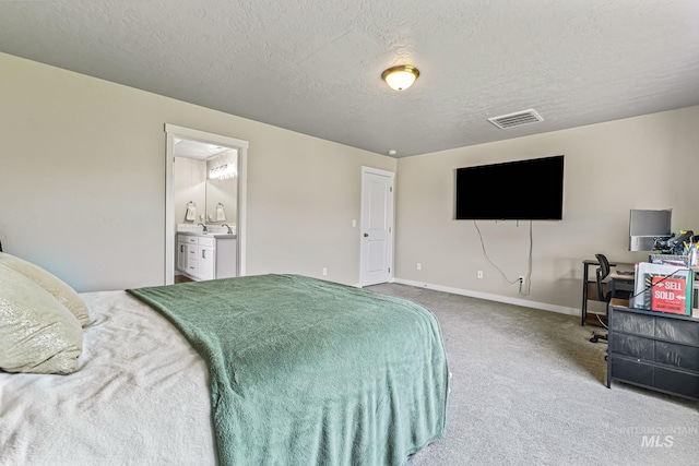 10255 W Gladiola St, Star, ID 83669 - carpeted bedroom with a textured ceiling, a desk, and connected bathroom