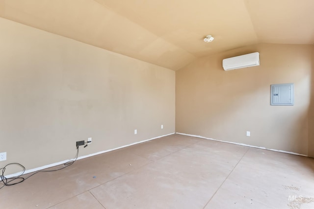 10255 W Gladiola St, Star, ID 83669 - unfurnished room with a wall unit AC, electric panel, vaulted ceiling, and concrete flooring