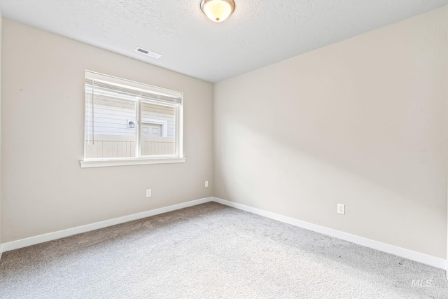 10255 W Gladiola St, Star, ID 83669 - unfurnished room featuring carpet floors and a textured ceiling