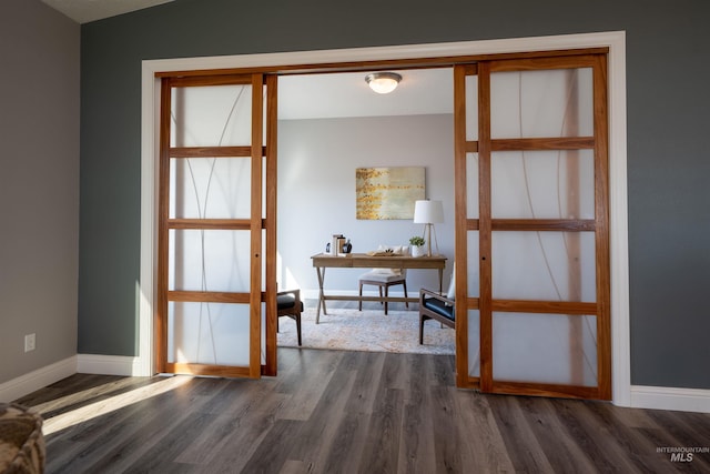 office space featuring dark wood-style floors and baseboards