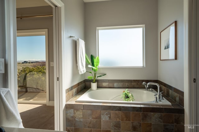 bathroom with a garden tub