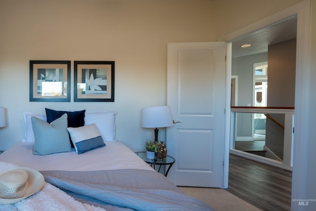 bedroom featuring recessed lighting and wood finished floors