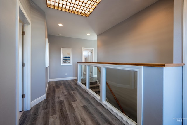 hall with recessed lighting, baseboards, and wood finished floors