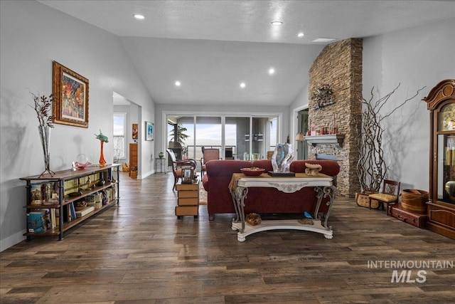 16353 Brunello Ct, Caldwell, ID 83607 - living area with lofted ceiling, wood finished floors, a fireplace, and recessed lighting