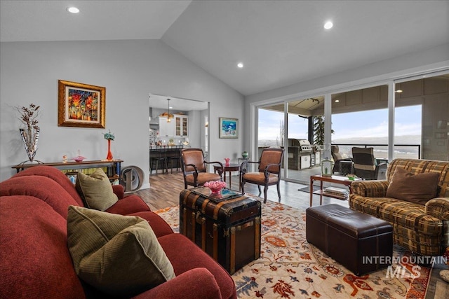 16353 Brunello Ct, Caldwell, ID 83607 - living room with light wood finished floors, recessed lighting, and high vaulted ceiling