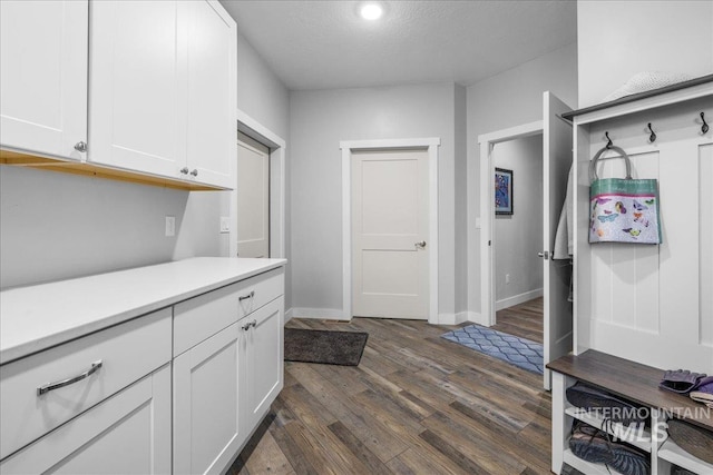 16353 Brunello Ct, Caldwell, ID 83607 - washroom with dark wood finished floors, a textured ceiling, and recessed lighting
