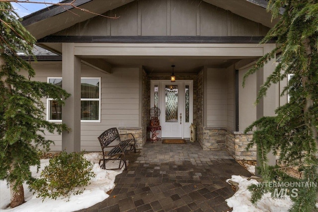 16353 Brunello Ct, Caldwell, ID 83607 - view of exterior entry featuring stone siding and board and batten siding