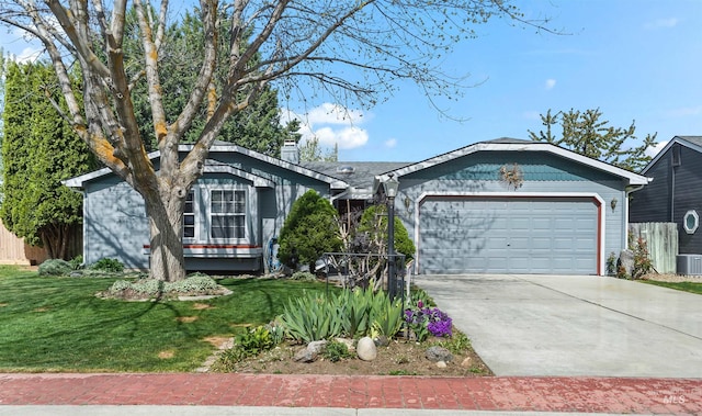 ranch-style home with fence, a front yard, a chimney, an attached garage, and driveway