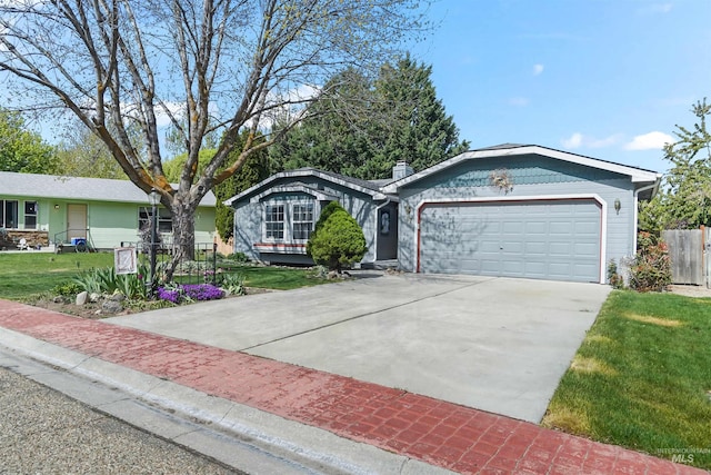 ranch-style home with an attached garage, fence, a front yard, and concrete driveway