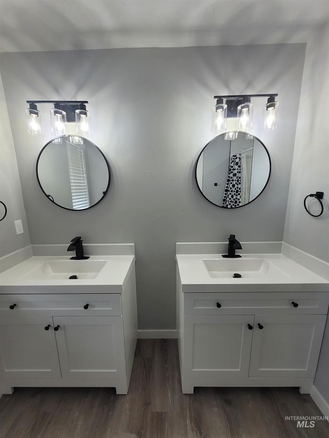 bathroom featuring hardwood / wood-style flooring and vanity