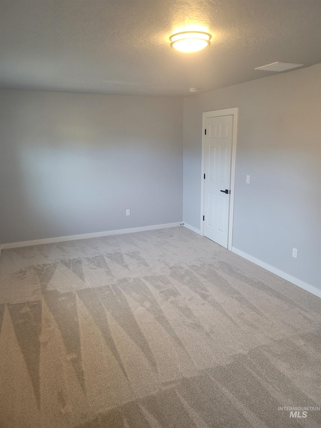 spare room with carpet