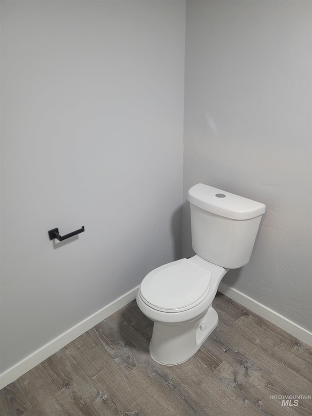 bathroom featuring toilet and hardwood / wood-style floors