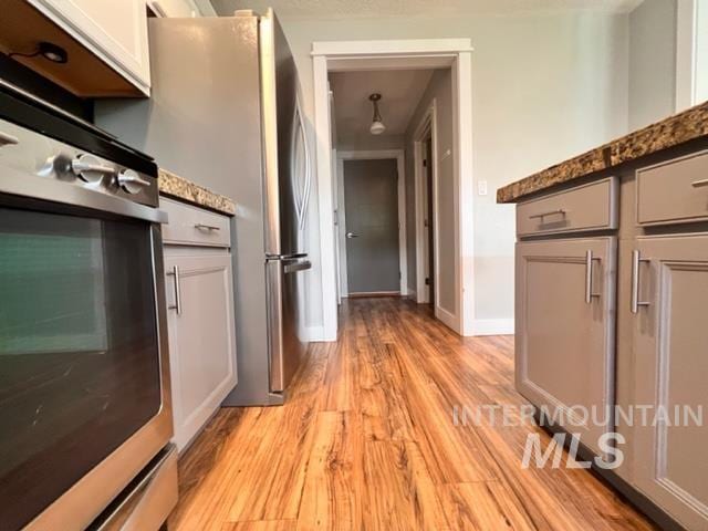 hall with light hardwood / wood-style flooring