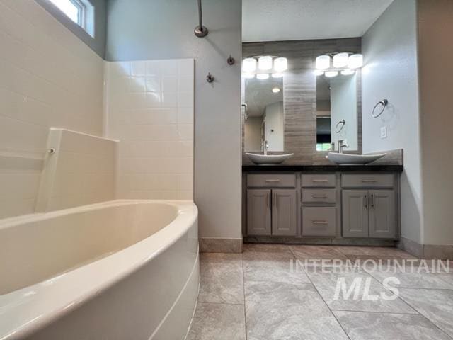 bathroom featuring tile patterned floors and vanity