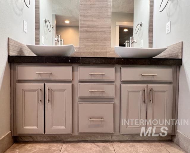 bathroom featuring tile patterned floors and vanity