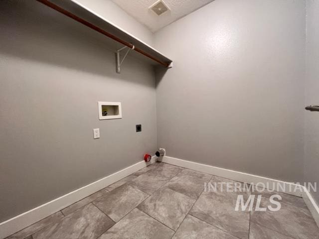 laundry area with hookup for a washing machine and hookup for an electric dryer