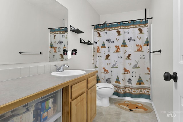 bathroom with vanity, toilet, and a shower with shower curtain