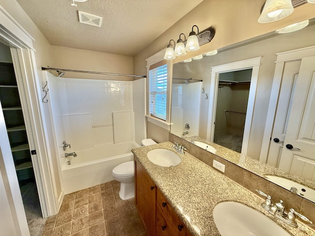 1241 W Ann Taylor St, Meridian, ID 83646 - bathroom with a textured ceiling, toilet, a spacious closet, shower / washtub combination, and double vanity