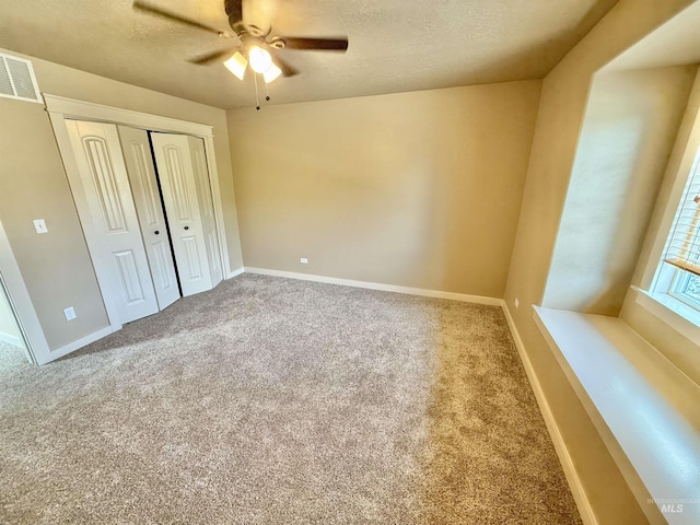 1241 W Ann Taylor St, Meridian, ID 83646 - unfurnished bedroom featuring carpet flooring, a textured ceiling, a closet, baseboards, and ceiling fan