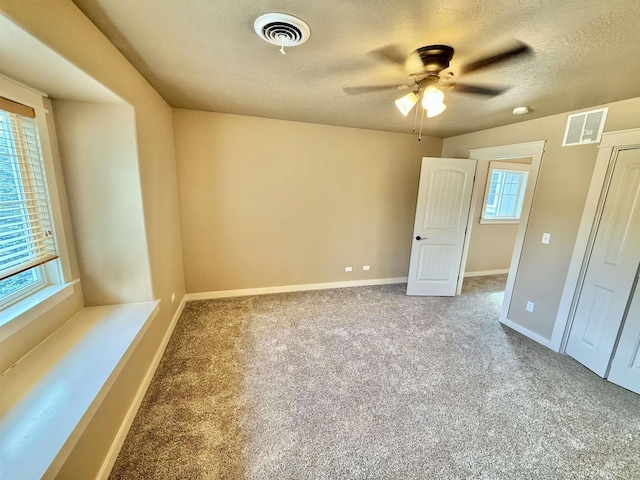 1241 W Ann Taylor St, Meridian, ID 83646 - carpeted empty room with ceiling fan, a textured ceiling, and baseboards