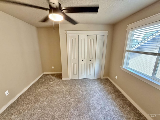 1241 W Ann Taylor St, Meridian, ID 83646 - unfurnished bedroom featuring a textured ceiling, carpet, a closet, ceiling fan, and baseboards