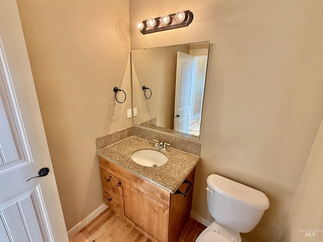 1241 W Ann Taylor St, Meridian, ID 83646 - half bath with toilet, wood finished floors, and vanity