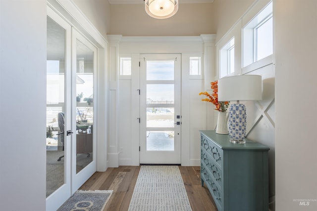 doorway to outside with french doors and light wood-type flooring