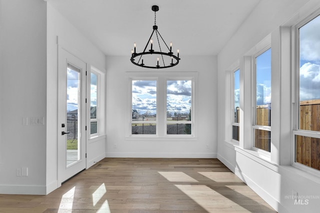 11321 S Yeoman St, Kuna, ID 83634 - unfurnished sunroom featuring a chandelier and french doors