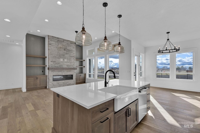 11321 S Yeoman St, Kuna, ID 83634 - kitchen featuring a sink, dishwasher, recessed lighting, light wood-style flooring, and baseboards