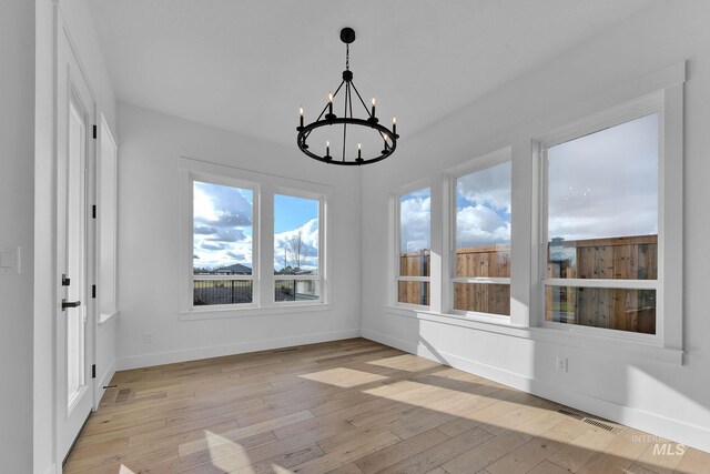 11321 S Yeoman St, Kuna, ID 83634 - unfurnished sunroom with a chandelier and plenty of natural light