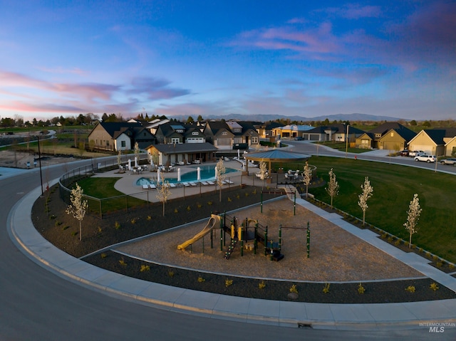 11321 S Yeoman St, Kuna, ID 83634 - aerial view at dusk of a residential view and view of pool