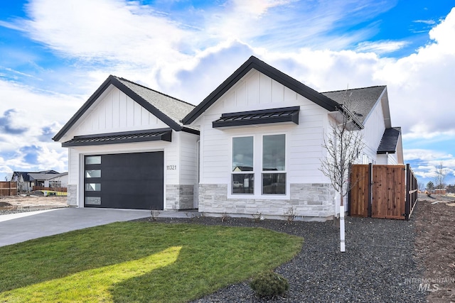 modern farmhouse style home with a garage and a front yard