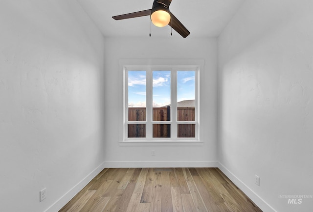 unfurnished room featuring ceiling fan and light hardwood / wood-style flooring