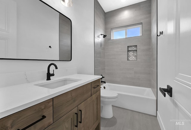 full bathroom with vanity, toilet, and tiled shower / bath