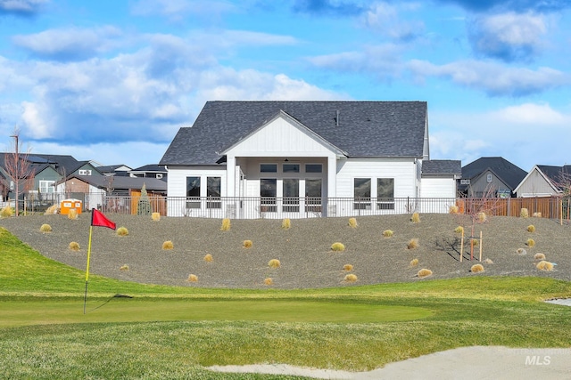 11321 S Yeoman St, Kuna, ID 83634 - rear view of property featuring roof with shingles, french doors, and view of golf course