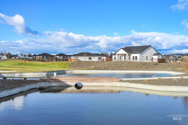 view of pool with a water view