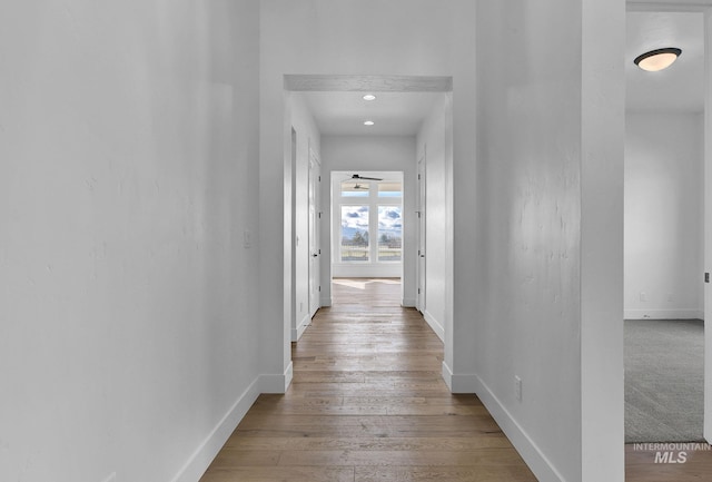 hallway with light wood-type flooring