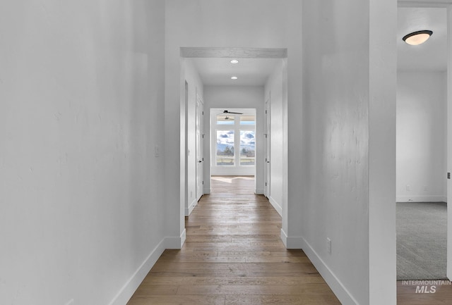 11321 S Yeoman St, Kuna, ID 83634 - hall with baseboards, wood finished floors, and recessed lighting