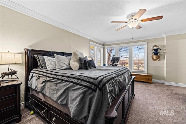 bedroom with dark colored carpet, ornamental molding, a ceiling fan, a textured ceiling, and baseboards