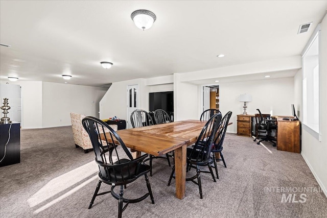 carpeted dining space featuring baseboards, visible vents, and recessed lighting