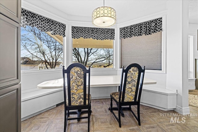 dining space with baseboards